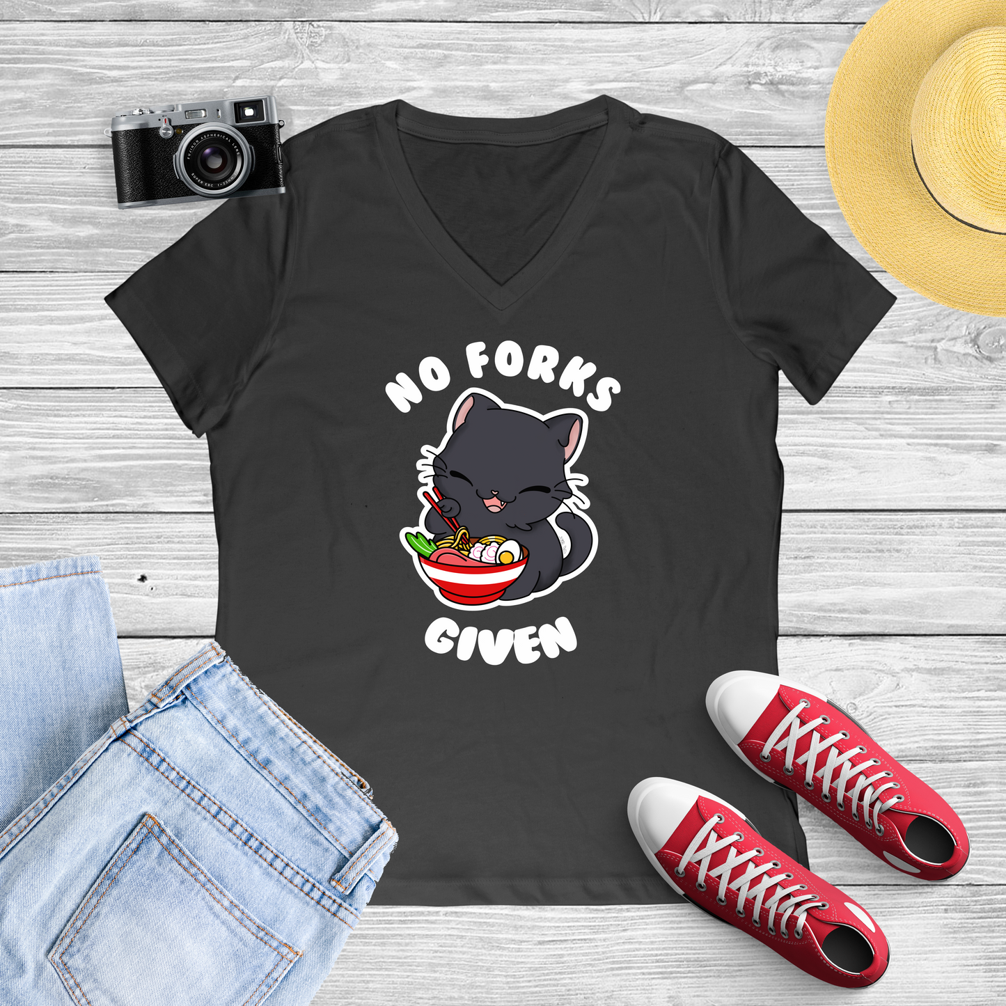 Black Shirt with a graphic of a Cat eating Ramen With chop sticks and the shirt reads "No forks given"