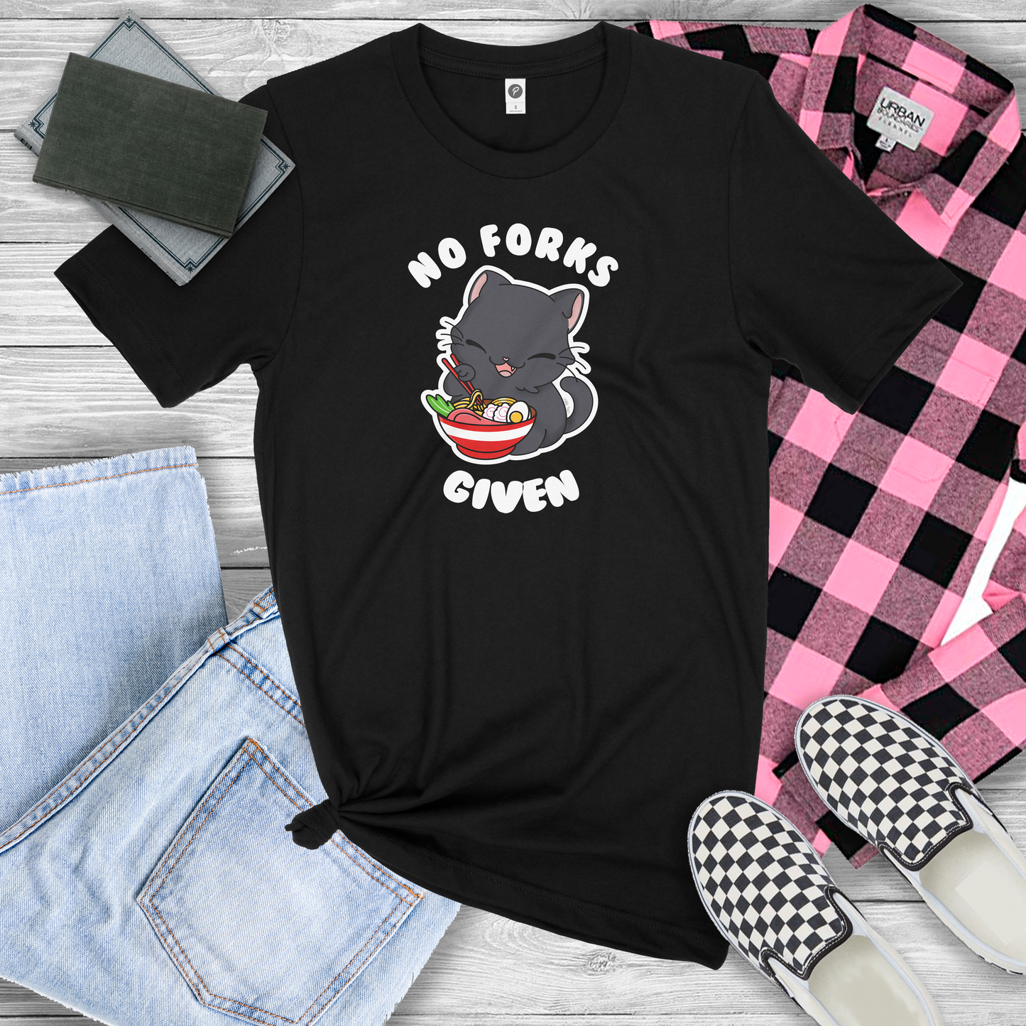 Black Shirt with a graphic of a Cat eating Ramen With chop sticks and the shirt reads "No forks given"