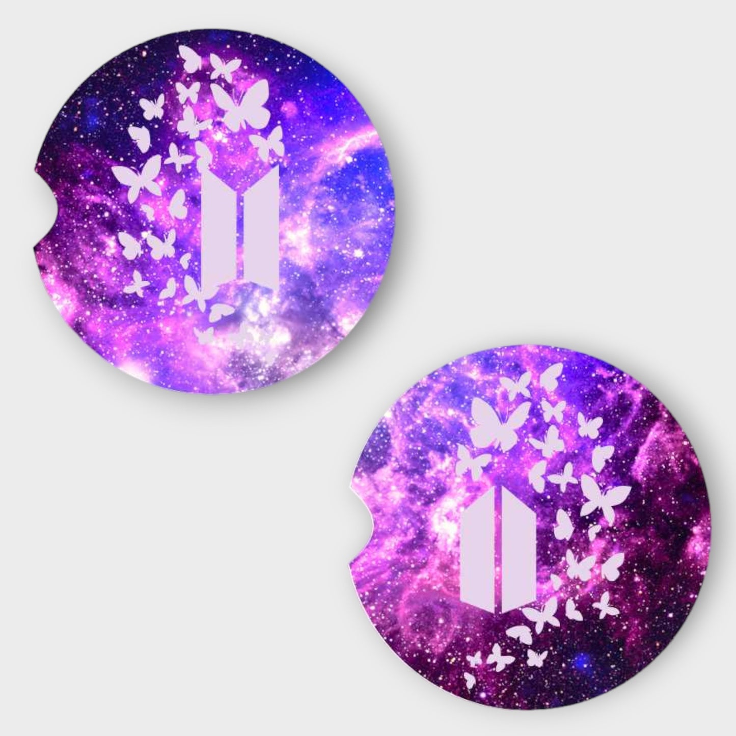 A set of 2 Round Car Coasters, with purple galaxy background. And both have white butterflies, one has the BTS Logo and the other has the ARMY Logo.