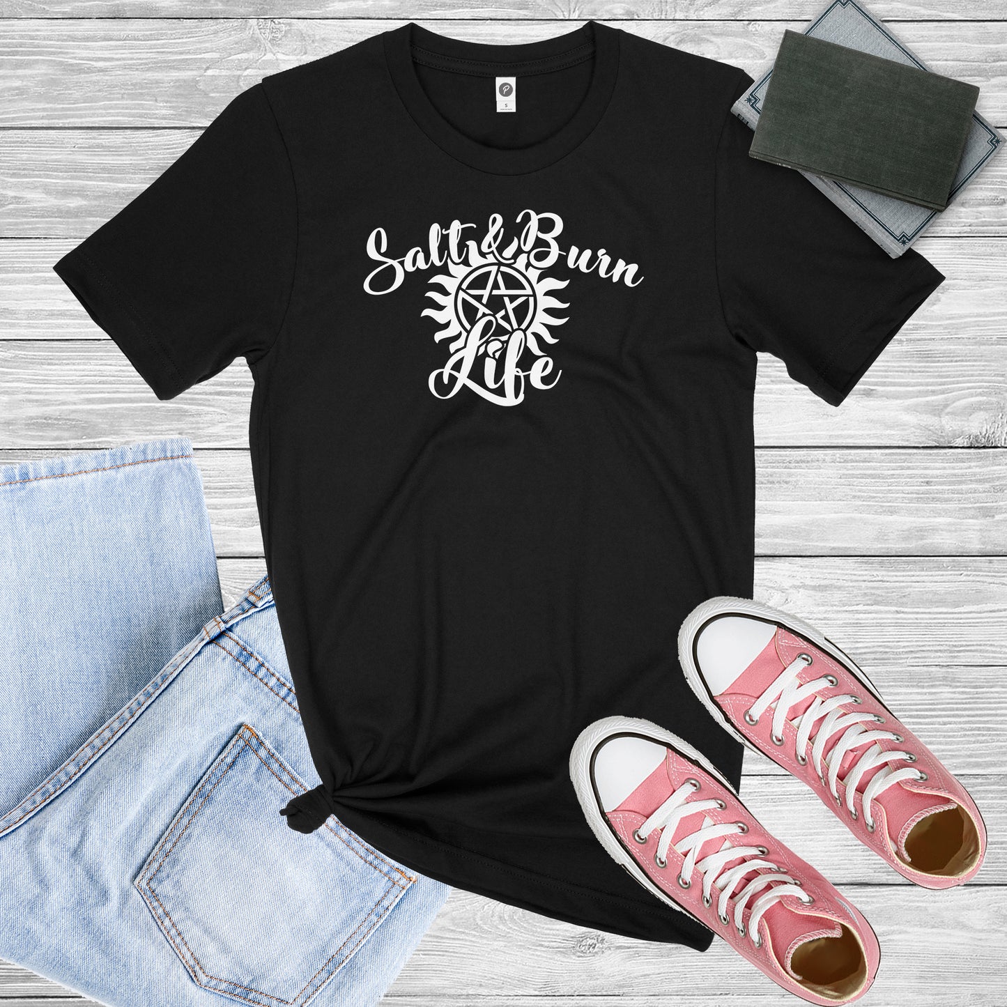 Black Shirt with White graphic of the Supernatural Protection Symbol and the Words "Salt and Burn Live"