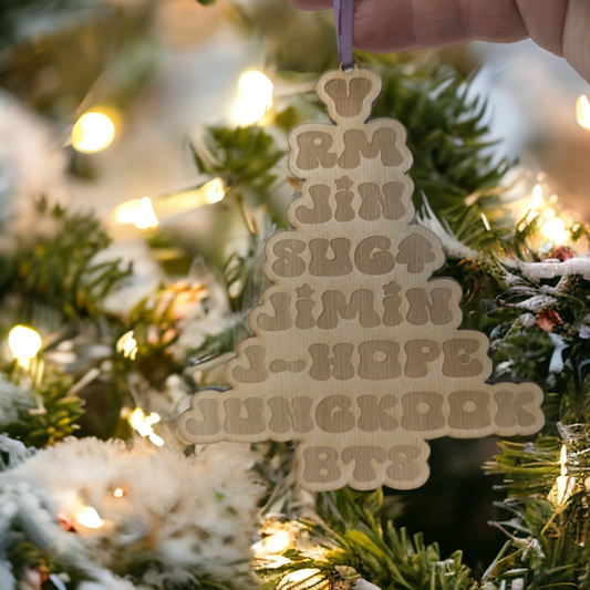 Wooden Ornament with the names of the Members of BTS and they are arranged like a Christmas Tree