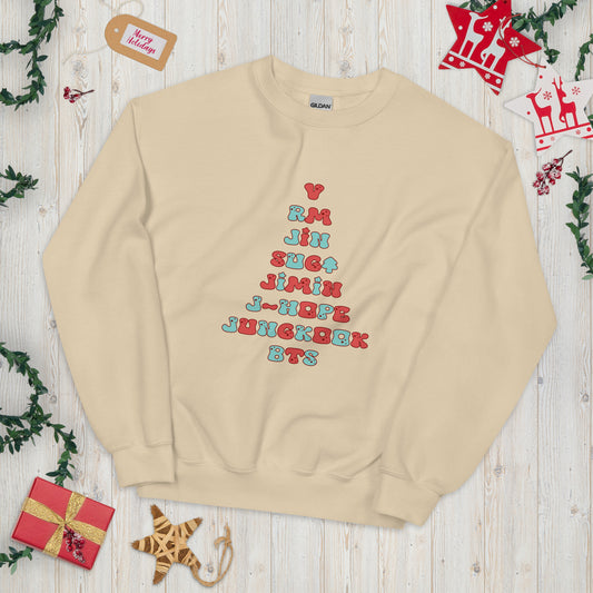 Tan Sweatshirt with all 7 names of BTS arranged to make a Christmas Tree shape. 