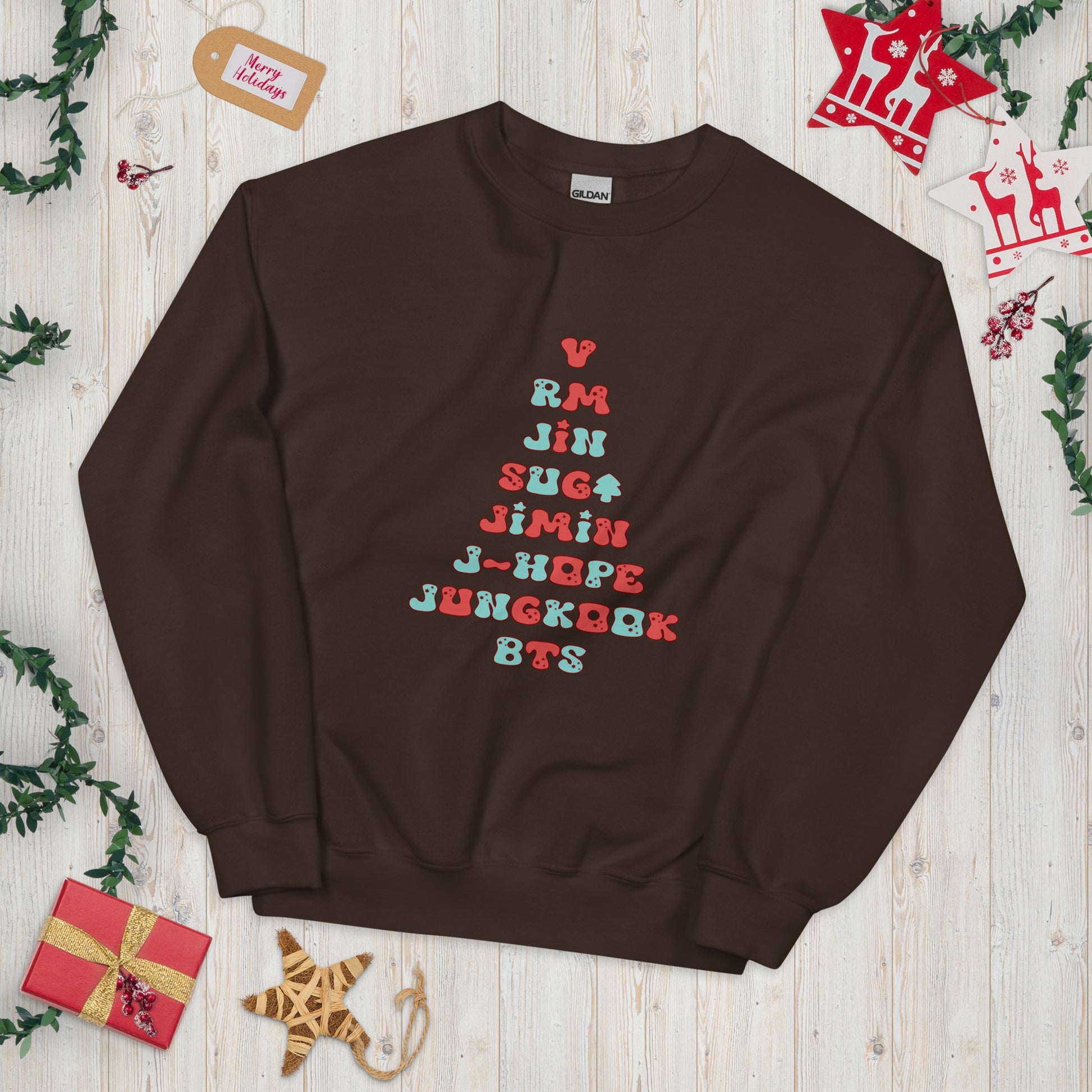 Chocolate Sweatshirt with all 7 names of BTS arranged to make a Christmas Tree shape. t mockup