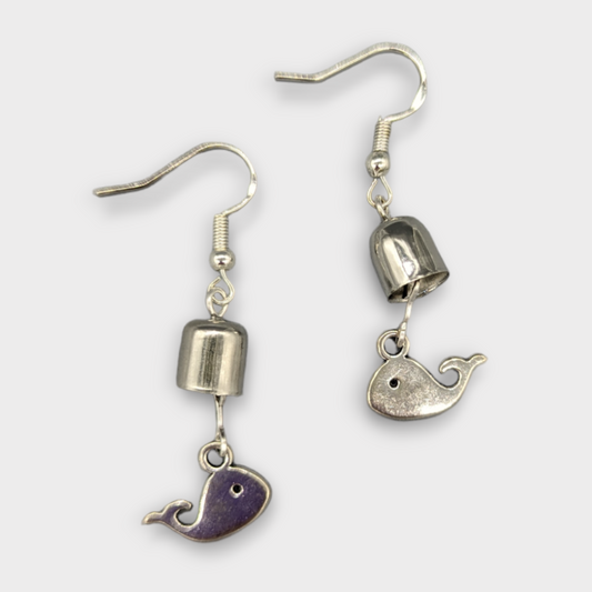 Earrings with a whale and a bell. 