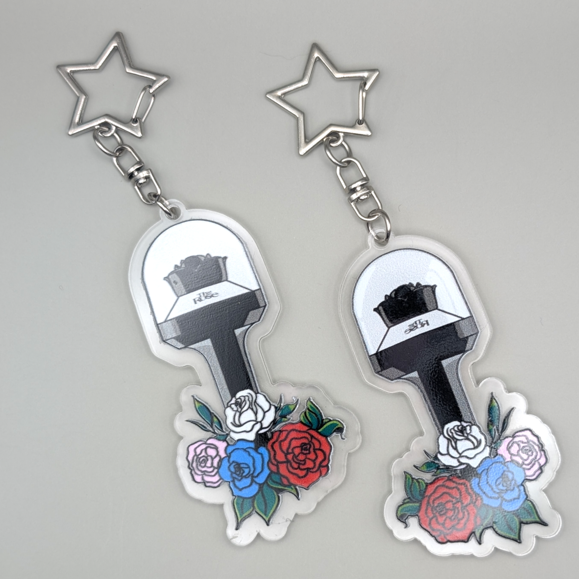 The Rose Lightstick, with 4 roses in colors corresponding with the Members. Silver Keyring is Star shaped