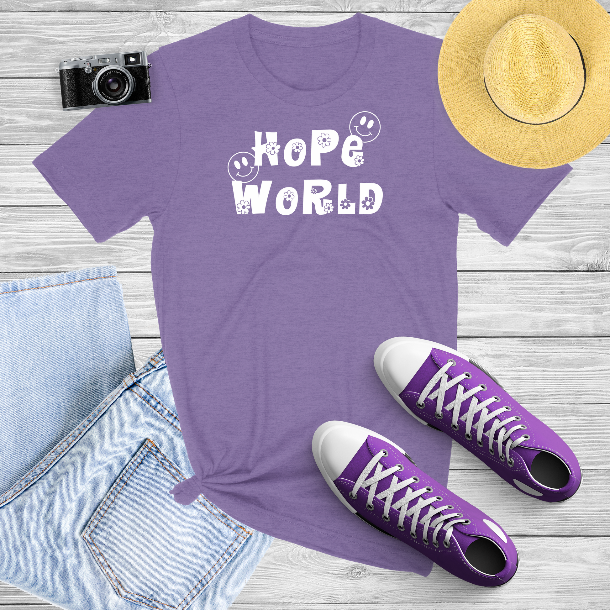 Purple Shirt with White print of the words "Hope World" with a cute font with flowers and smiley Face 