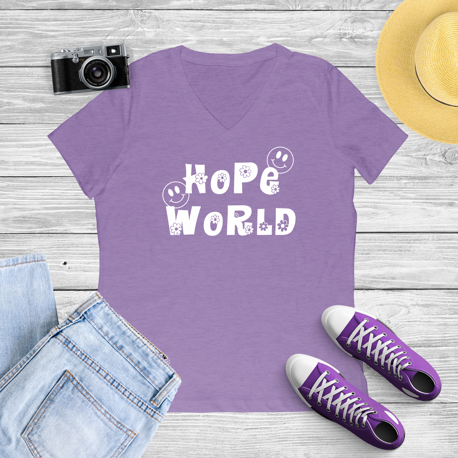 Purple Shirt with White print of the words "Hope World" with a cute font with flowers and smiley Face 